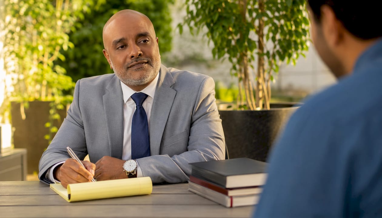 Personal injury attorney consulting client in office