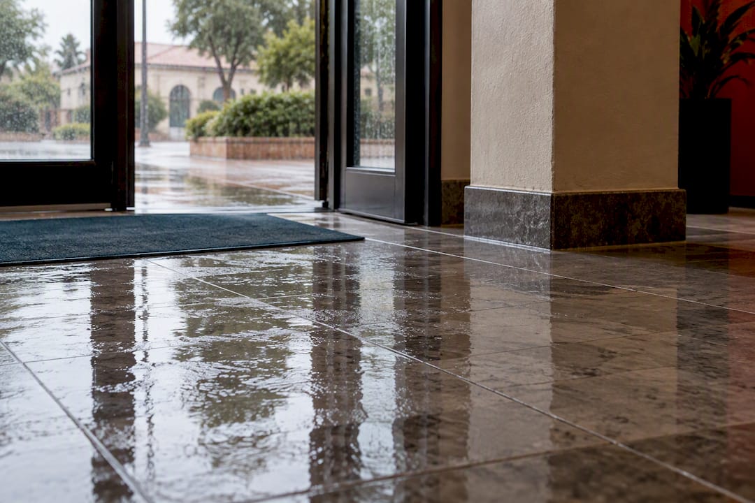 Wet tile floor without warning signage
